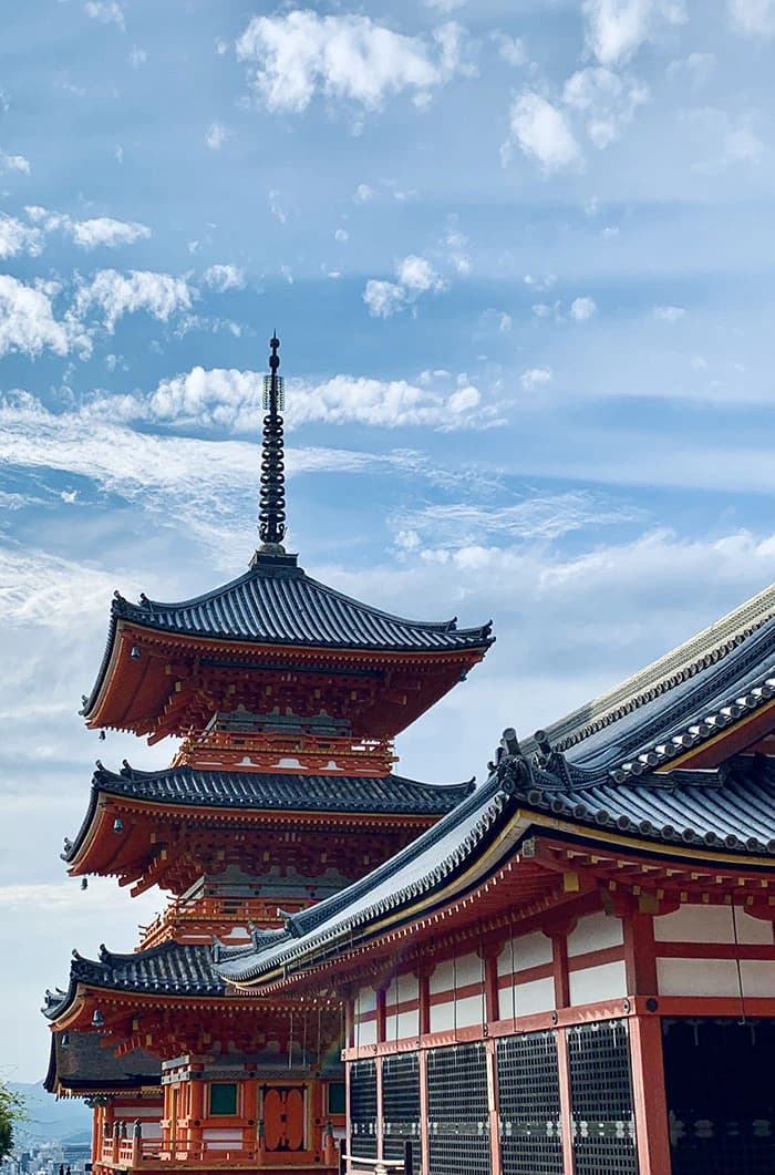 a traditional Japanese temple surrounded by trees