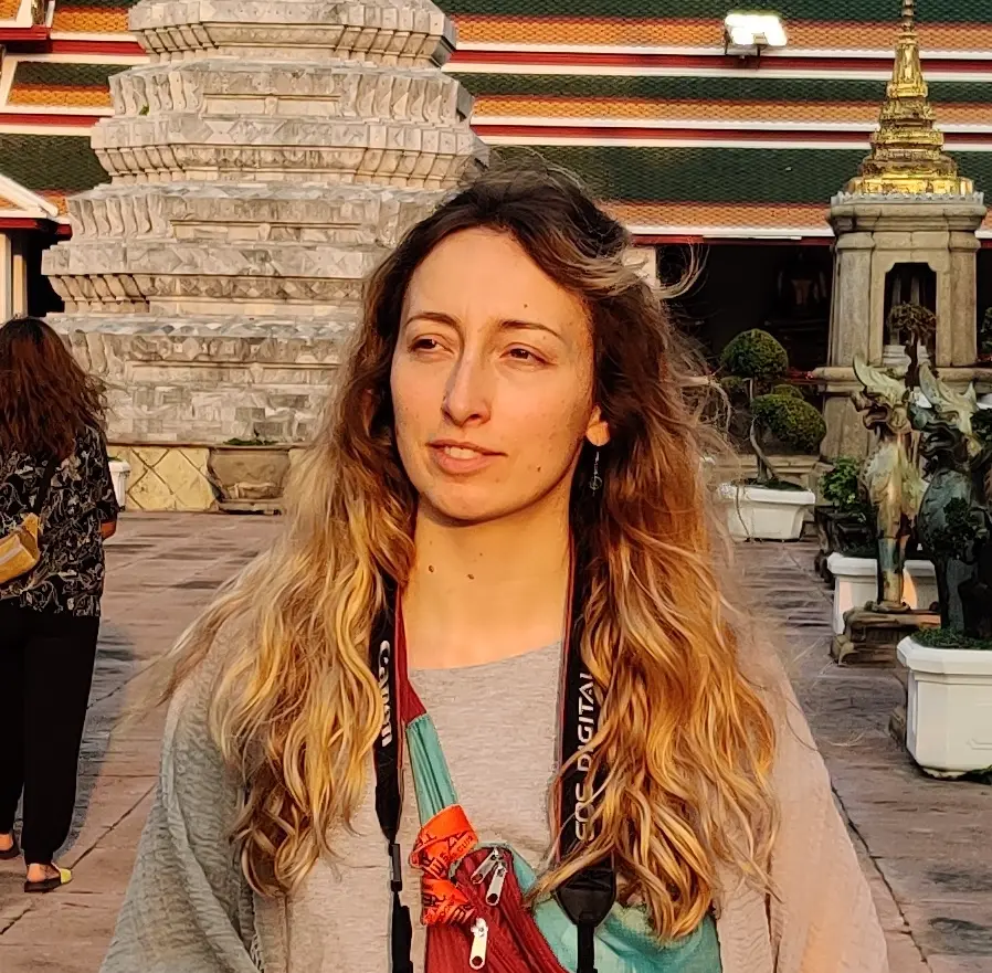 Bea Bea smiling while holding a bhan mi