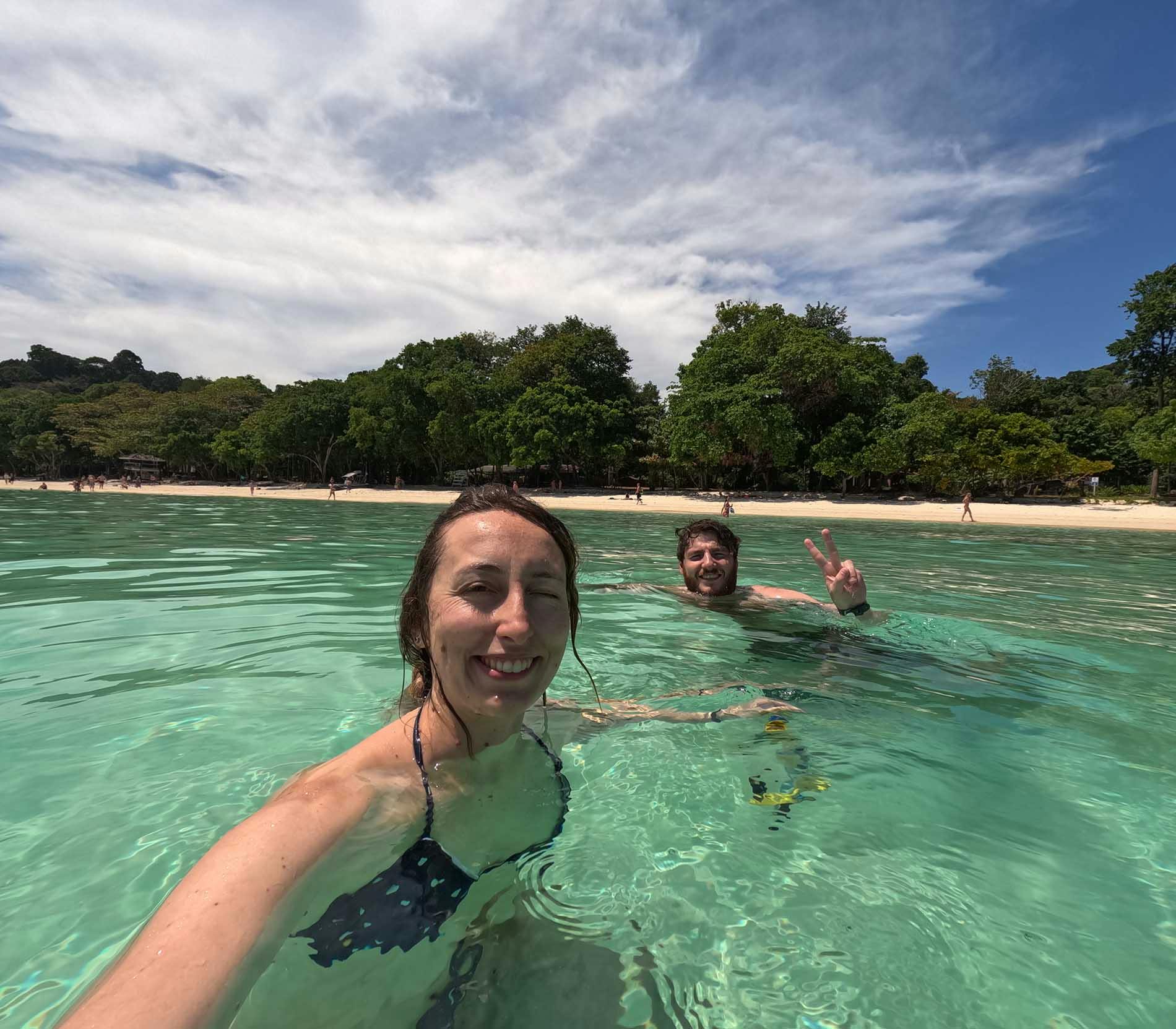A selfie of Beatrice and Davide swimming in the turquoise water of Koh Rok, an island in the Gulf of Thailand